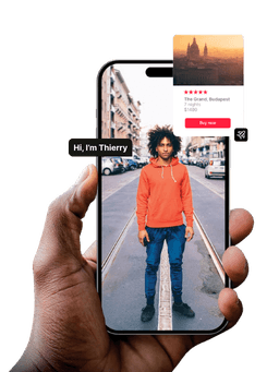 Hand holding smartphone displaying a person in orange jacket on street with travel app interface