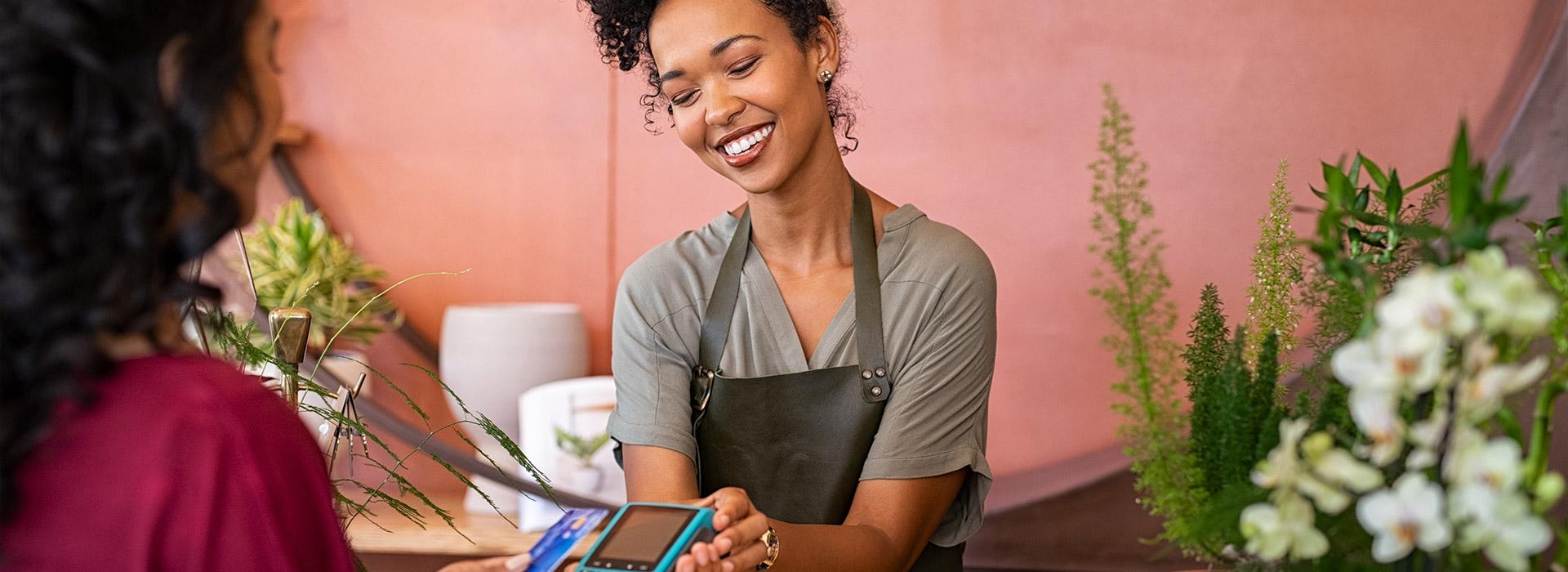 Women engaged in a retail transaction