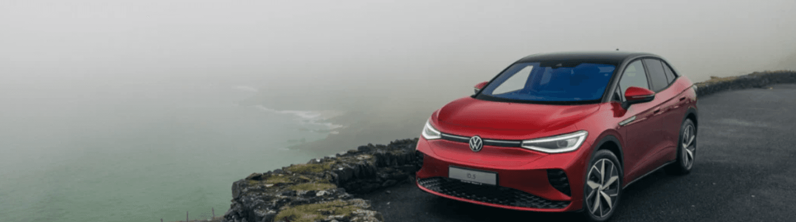 Red car on the edge of a cliff